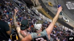 Race fans cheer the start of a NASCAR auto race in Bristol, Tennessee, Sept. 17, 2022.