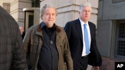 Steve Bannon, center, a longtime ally of former President Donald Trump and convicted of contempt of Congress, accompanied by his attorney Evan Corcoran, right, leaves the federal courthouse in Washington, D.C., Oct. 21, 2022.