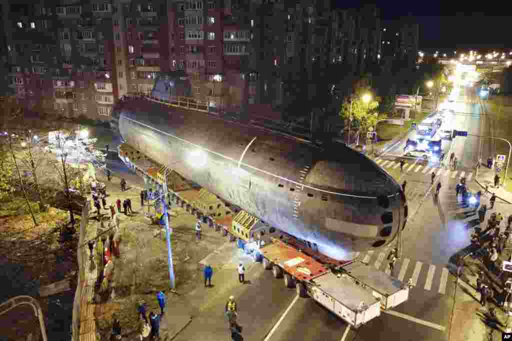 The bow of the Soviet submarine K-3 &#39;Leninsky Komsomol&#39; is transported from the pier to the museum in the city of Kronstadt, outside St. Petersburg, Russia.