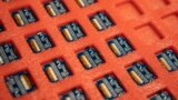 (FILE) Semi-conductor chips are assembled and organized on a workbench before a ribbon-cutting ceremony to mark the opening of a Nanotronics manufacturing center at the Brooklyn Navy Yard, Wednesday, April 28, 2021, in the Brooklyn borough of New York.