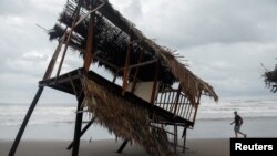 A palm leaf shade, known as palapa, is pictured damaged on the beach following the passing of Hurricane Roslyn that hit Mexico's Pacific coast with heavy winds and rain in San Blas in Nayarit state, Mexico, October 23, 2022.