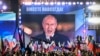 블라디미르 푸틴(화면) 러시아 대통령이 지난달 30일 모스크바 붉은광장에서 열린 우크라이나 4개 점령지 병합 조약 체결 축하 콘서트에 참석해 "승리는 우리의 것"이라고 외치고 있다. 화면 상단에는 '영원히 함께!'라고 써 있다. (자료사진)
