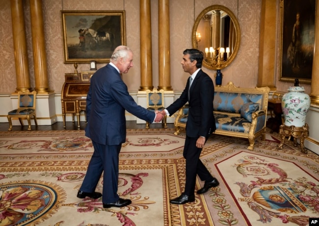 King Charles III welcomes Rishi Sunak during an audience at Buckingham Palace, London, where he invited the newly elected leader of the Conservative Party to become Prime Minister and form a new government, Oct. 25, 2022. (Aaron Chown/Pool photo via AP)