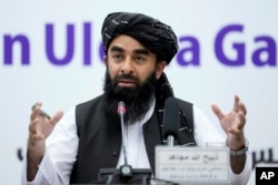 FILE - Zabihullah Mujahid, the spokesman for the Taliban government, speaks during a press conference in Kabul, Afghanistan, June 30, 2022.