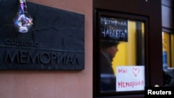 FILE - A man leaves the office of the human rights group Memorial in Moscow, Dec. 29, 2021. The organization was liquidated by Russian officials, but it was co-awarded the Nobel Peace Prize on Oct. 7, 2022.