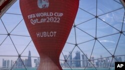 A count down clock is displayed at the seafront in Doha, Qatar, Tuesday, March 29, 2022. Qatar's residents squeezed as World Cup rental demand soars. (AP Photo/Darko Bandic, File)