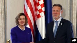 House Speaker, U.S. Representative Nancy Pelosi, left, shakes hands with Speaker of the Croatian Parliament Gordan Jandrokovic, before a two-day summit of European parliaments' speakers with the leaders of Ukraine, in Zagreb, Croatia, Oct. 24, 2022.