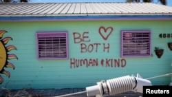 Graffiti is seen in a house after Hurricane Ian caused widespread destruction in Matlacha, Florida, Oct. 2, 2022. 