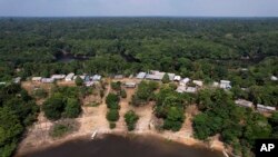 An aerial view of the Bela Vista do Jaraqui community where electoral workers arrived with electronic voting machines to be delivered to polling stations, a day ahead of the country's elections, in Manaus, Amazonas state, Brazil, Oct. 1, 2022.