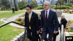 Australia's Prime Minister Anthony Albanese walks with Japan's Prime Minister Fumio Kishida in Kings Park in Perth, Australia, on Oct. 22, 2022. 