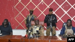 FILE - Burkina Faso's new self-proclaimed leader captain Ibrahim Traore attends a meeting in Ouagadougou on Oct. 2, 2022.