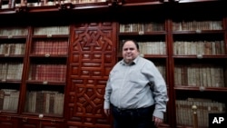 FILE -Juan Fernandez del Campo, manager of the Palafoxiana library, the oldest public library in the Americas, poses for a portrait in Puebla, Mexico, Sept. 13, 2022.