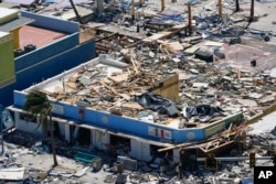 Business are seen in the wake of Hurricane Ian, in Fort Myers Beach, Florida, Sept. 29, 2022.