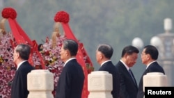 Chinese leaders, led by President Xi Jinping, lay wreaths on Tiananmen Square to mark Martyrs' Day on the eve of the National Day in Beijing, China