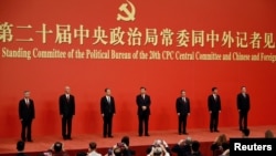 New Politburo Standing Committee members Xi Jinping, Li Qiang, Zhao Leji, Wang Huning, Cai Qi, Ding Xuexiang and Li Xi meet the media following the 20th National Congress of the Communist Party of China, at the Great Hall of the People in Beijing, China October 23, 2022.