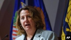 FILE - U.S. Deputy Attorney General Lisa Monaco speaks in Washington, May 6, 2022. She and other U.S. officials say entities and businesses need to take steps to protect against potential attacks in cyberspace.