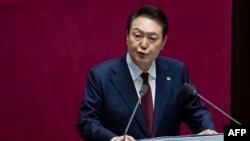 South Korean President Yoon Suk Yeol delivers a speech speaks on the government budget at the National Assembly in Seoul, Oct. 25, 2022. Yoon, who took office in May, said he wants to improve ties and has overseen expanded security cooperation with Tokyo.