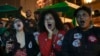 Supporters of Brazil's former President Luiz Inácio Lula da Silva, who is running for president again, watch television coverage of the presidential debate in the Saude neighborhood of Rio de Janeiro, Sept. 29, 2022.