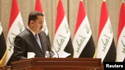Iraqi Prime Minister-designate Mohammed Shia al-Sudani speaks during a vote on Sudani's cabinet at the parliament in Baghdad, Oct. 27, 2022. (Iraqi Parliament Media Office handout photo)