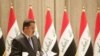 FILE -Iraqi Prime Minister Mohammed Shia al-Sudani speaks during a vote on Sudani's Cabinet at the parliament in Baghdad, Oct. 27, 2022. (Iraqi Parliament Media Office handout photo)