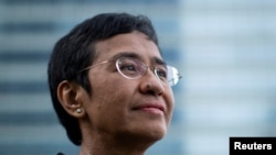FILE - Filipino journalist and Rappler CEO Maria Ressa, one of 2021 Nobel Peace Prize winners, poses for a portrait in Taguig City, Metro Manila, Philippines, October 9, 2021. 