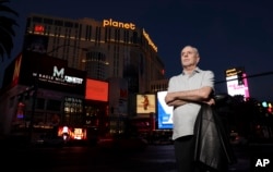 FILE - Investigative journalist Jeff German poses on the Strip in Las Vegas, June 2, 2021.