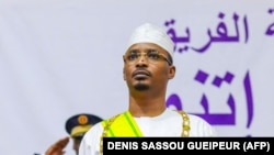 FILE: Mahamat Idriss Deby stands after having been sworn in as Chad's transitional president, in N'Djamena on October 10, 2022