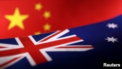 Printed Chinese and Australian flags are seen in this illustration, July 21, 2022. 