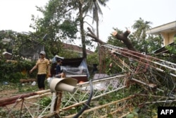 A man walks past a collapsed structure after Typhoon Noru made landfall in Hoi An, Vietnam's Quang Nam Province on September 28, 2022.