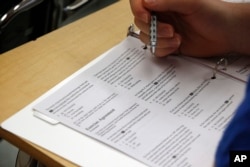 Standardized tests for college admissions are not being taken as often. However, when students do take the tests, their scores are falling. (AP Photo/Alex Brandon)