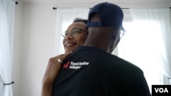 Morris Kple Roberts is seen hugging his father, Isaiah Roberts, in Jacksonville, Florida.