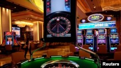 FILE - Gaming machines are seen at the casino of MGM Cotai in Macau, China Feb. 13, 2018.
