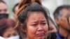 A relative mourns during a ceremony for those killed in the attack on the Young Children's Development Center in the rural town of Uthai Sawan, northeastern Thailand, Oct. 7, 2022. 
