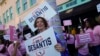 FILE - Supporters of Democratic candidate for governor Charlie Crist and Florida's Republican Gov. Ron DeSantis stand outside the Sunrise Theatre ahead of their debate, in Fort Pierce, Fla., Oct. 24, 2022.