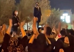 This image from a UGC video shows Iranian women protesting in the central city of Yazd on September 26, 2022, following the death of Mahsa Amini. (AFP)