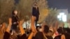 Iran Riot Police Confronting Protesters in Tehran Over Death of Woman 