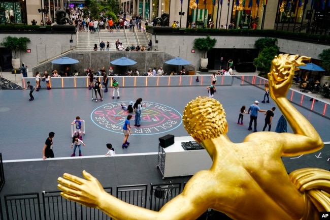 FILE - People roller skate at Rockefeller Center in New York on June 21, 2022, in New York. Roller skating has been enjoying a 2020s revival. (AP Photo/Frank Franklin II, File)