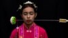 A medium woman with her mouth pierced is portrayed while in trance during the Jui Tui Shrine procession amidst celebrations of the annual vegetarian festival, observed by Taoist devotees from the Thai-Chinese community in the ninth lunar month of the Chin