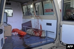 A blood-stained ambulance is pictured outside a hospital following strikes by Iran on the village of Altun Kupri, south of the capital Arbil, in Iraq's autonomous Kurdistan region, Sept. 28, 2022.