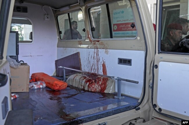 A blood-stained ambulance is pictured outside a hospital following strikes by Iran on the village of Altun Kupri, south of the capital Arbil, in Iraq's autonomous Kurdistan region, Sept. 28, 2022.