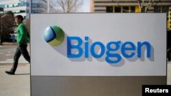 FILE PHOTO: A sign marks a Biogen facility in the city of Cambridge in the U.S. state of Massachusetts, March 9, 2020. 