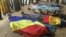 FILE: Bodies covered by Chadian flag are lined up on the ground during a protest in NDjamena, Chad, Oct. 20, 2022. 
