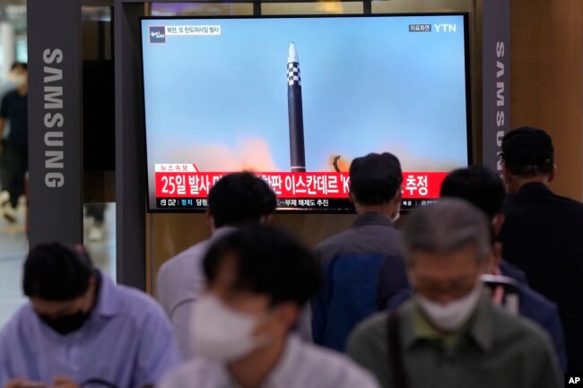 A TV screen shows a file image of a North Korea missile launch during a news program at the Seoul Railway Station in Seoul, South Korea, Sept. 28, 2022.