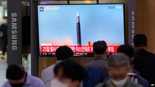 A TV screen shows a file image of a North Korea missile launch during a news program at the Seoul Railway Station in Seoul, South Korea, Sept. 28, 2022.