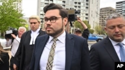 FILE - Bruce Lehrmann, center, arrives at the Australian Capital Territory Supreme Court in Canberra, Australia, Oct. 4, 2022. The jury in the high-profile case was discharged after a juror brought research about sexual assault into the jury room.