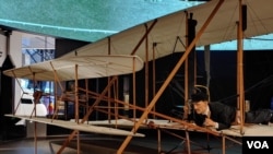 The original Wright Flyer, invented by the Wright Brothers, is the first powered and piloted aircraft. The first flight lasted for 12 seconds at Kitty Hawk, North Carolina, in 1903. (Deborah Block/VOA)