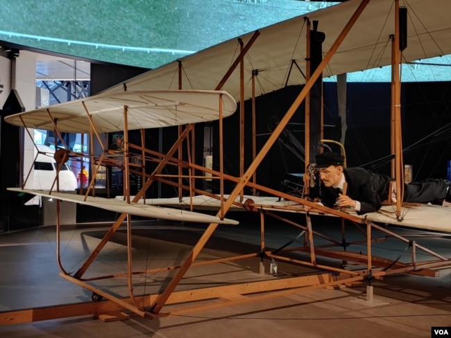 The original Wright Flyer, invented by the Wright Brothers, is the first powered and piloted aircraft. The first flight lasted for 12 seconds at Kitty Hawk, North Carolina, in 1903. (Deborah Block/VOA)