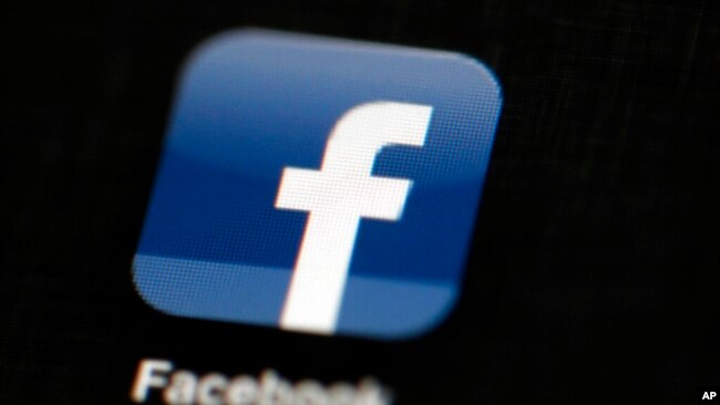 FILE - The Facebook logo is displayed on an iPad in Philadelphia, May 16, 2012.