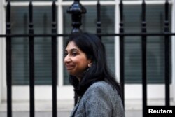 FILE - Britain's Secretary of State for the Home Department Suella Braverman walks outside Number 10 Downing Street in London, Britain, Oct. 18, 2022.