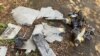 FILE - Parts of an unmanned aerial vehicle, what Ukrainian authorities consider to be an Iranian-made 'kamikaze drone' Shahed-136, are seen seen after a Russian strike on a fuel storage facility in Kharkiv, Ukraine, Oct. 6, 2022. 